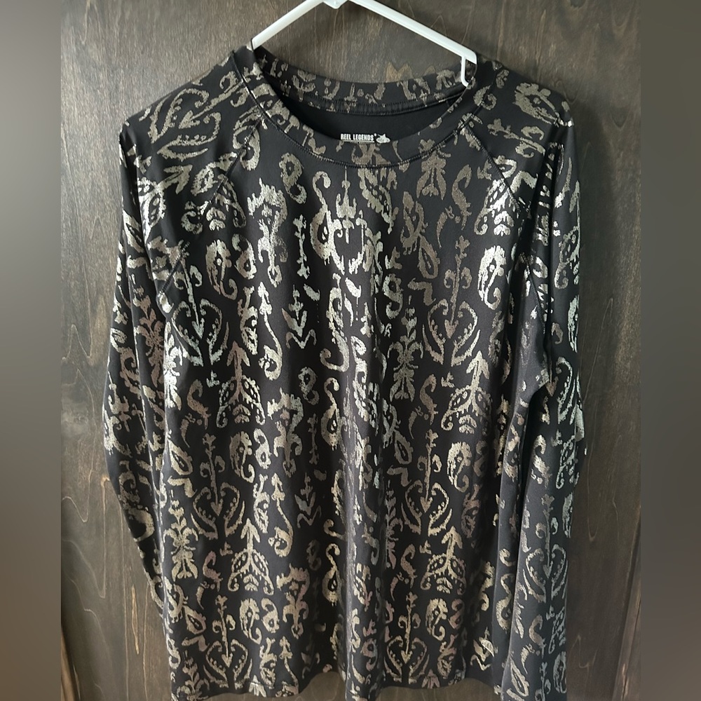 Size L Reel Legends rash guard.